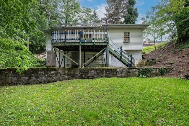 222 S Pike St, New Carlisle, OH 45344 - back of property featuring stairway, a deck, and a lawn