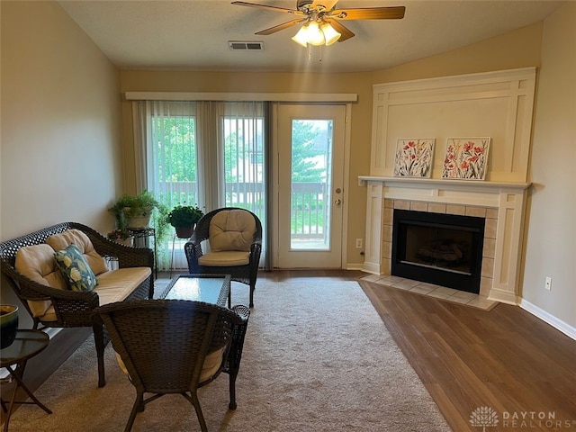 1640 Piper Ln Unit 206, Dayton, OH 45440 - living area featuring ceiling fan, a fireplace, wood finished floors, and baseboards