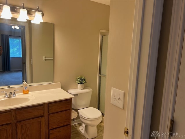 1640 Piper Ln Unit 206, Dayton, OH 45440 - bathroom featuring toilet, vanity, and a shower with door