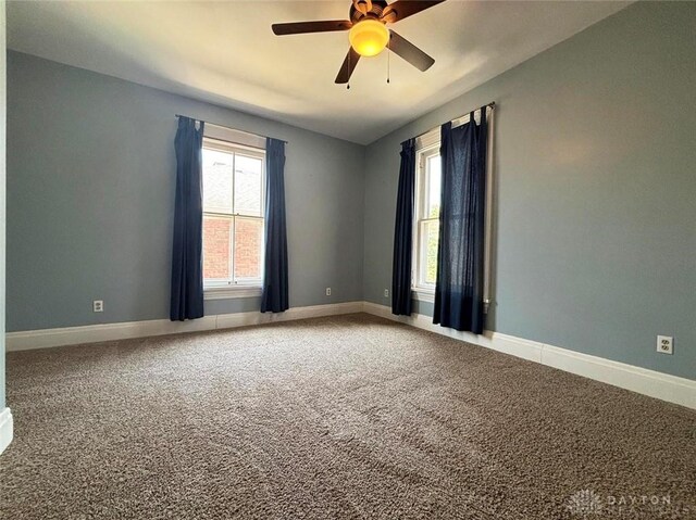 142 W Church St, Xenia, OH 45385 - carpeted empty room with a ceiling fan and baseboards