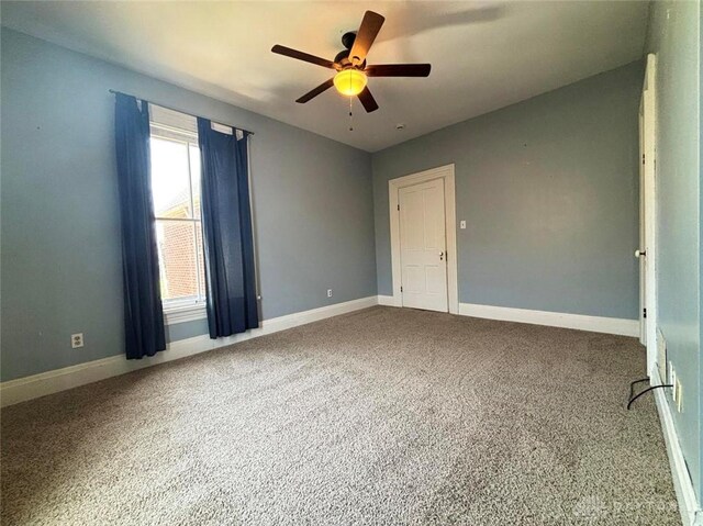 142 W Church St, Xenia, OH 45385 - spare room featuring a ceiling fan, carpet, and baseboards