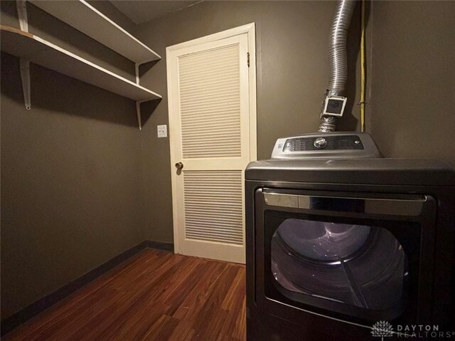 142 W Church St, Xenia, OH 45385 - laundry area with washer / dryer, dark wood-style flooring, and baseboards