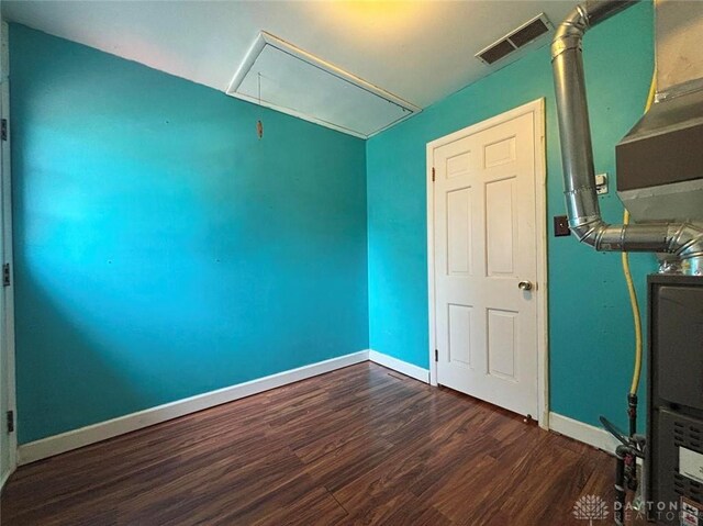 142 W Church St, Xenia, OH 45385 - spare room with attic access, wood finished floors, and baseboards