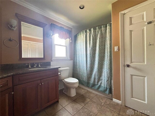 142 W Church St, Xenia, OH 45385 - bathroom with vanity, toilet, tile patterned flooring, and crown molding