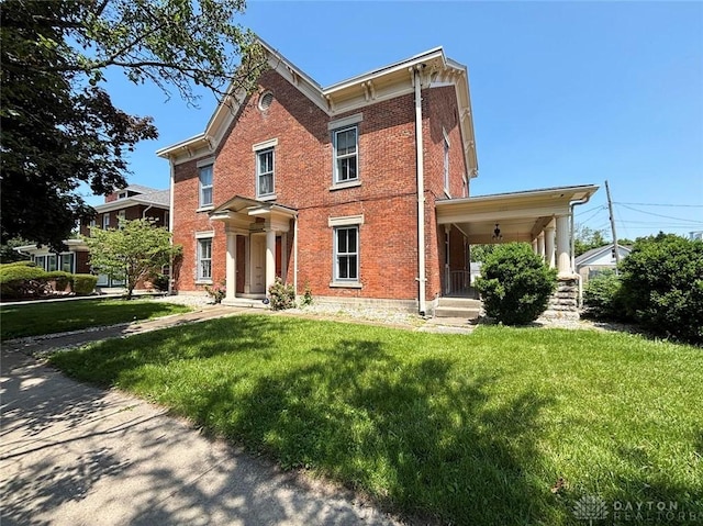 142 W Church St, Xenia, OH 45385 - italianate-style house with brick siding, a front lawn, and covered porch