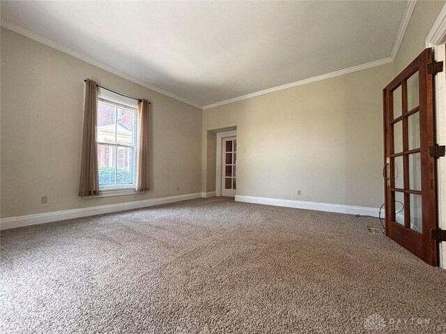 142 W Church St, Xenia, OH 45385 - empty room featuring crown molding, carpet floors, baseboards, and french doors