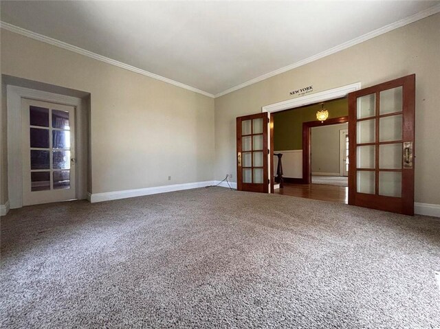 142 W Church St, Xenia, OH 45385 - empty room with french doors, ornamental molding, carpet floors, and baseboards