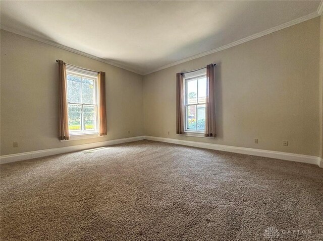 142 W Church St, Xenia, OH 45385 - carpeted spare room featuring ornamental molding and baseboards