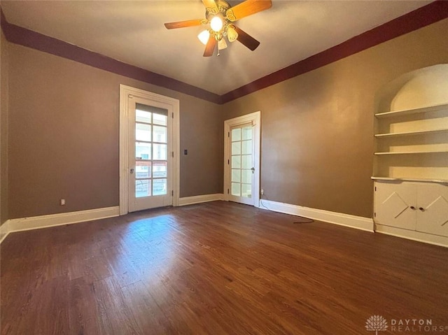 142 W Church St, Xenia, OH 45385 - unfurnished room with baseboards, dark wood-style floors, and a ceiling fan