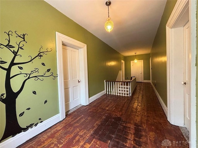 142 W Church St, Xenia, OH 45385 - corridor featuring an upstairs landing, wood-type flooring, baseboards, and vaulted ceiling