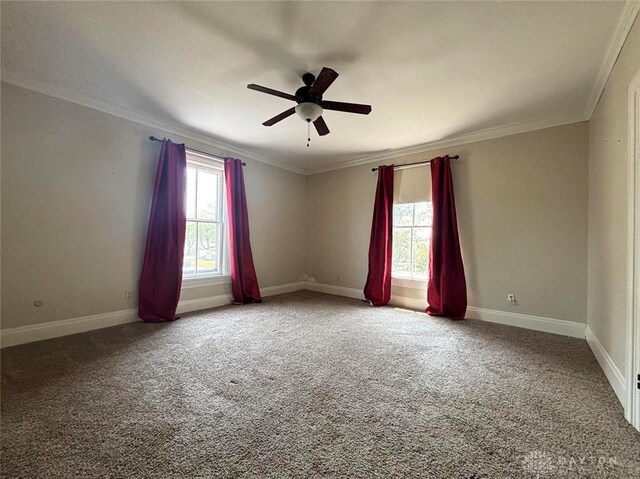 142 W Church St, Xenia, OH 45385 - carpeted spare room with a ceiling fan, crown molding, and baseboards