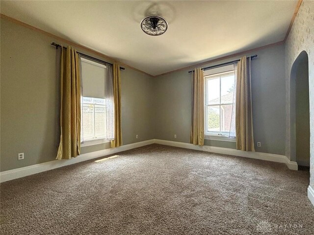 142 W Church St, Xenia, OH 45385 - carpeted empty room with crown molding and baseboards