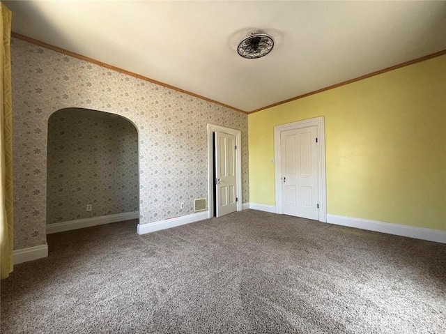 142 W Church St, Xenia, OH 45385 - spare room featuring ornamental molding, lofted ceiling, carpet flooring, wallpapered walls, and baseboards