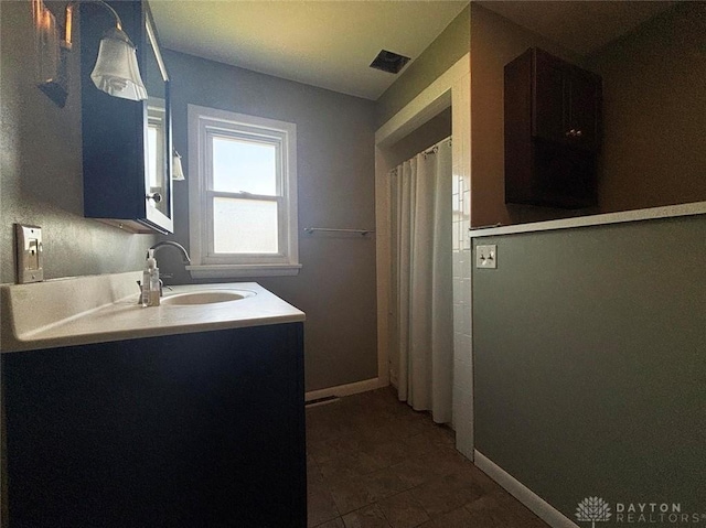 142 W Church St, Xenia, OH 45385 - full bath with vanity, tile patterned flooring, and baseboards