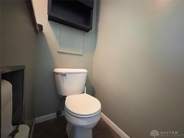 142 W Church St, Xenia, OH 45385 - bathroom featuring baseboards, toilet, and tile patterned floors
