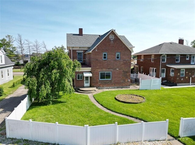 142 W Church St, Xenia, OH 45385 - back of property with brick siding and a chimney