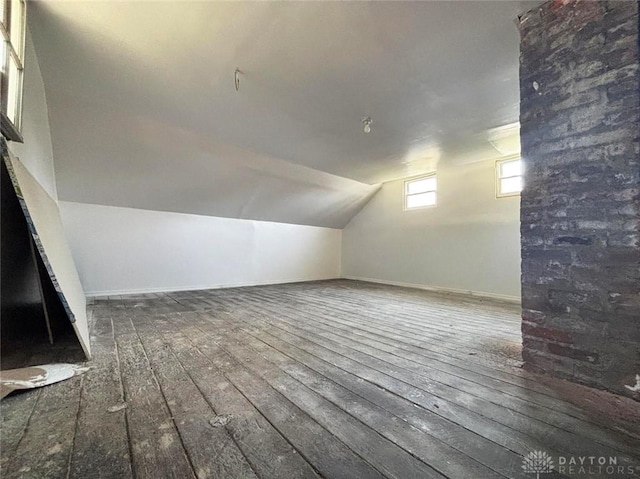 142 W Church St, Xenia, OH 45385 - bonus room with hardwood / wood-style flooring, vaulted ceiling, and baseboards