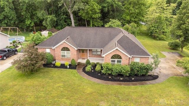 9062 Adam Ln, Waynesville, OH 45068 - ranch-style house featuring brick siding, a front yard, and a shingled roof