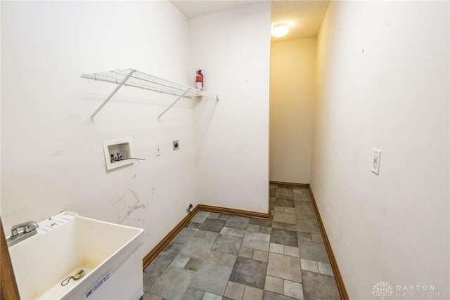 9062 Adam Ln, Waynesville, OH 45068 - laundry room with washer hookup, hookup for an electric dryer, and baseboards