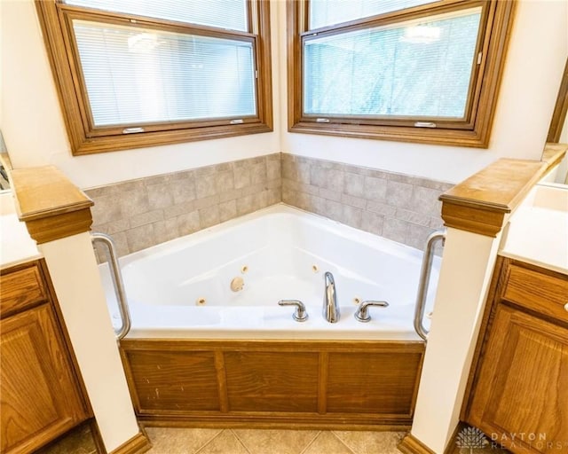 9062 Adam Ln, Waynesville, OH 45068 - bathroom featuring vanity, a jetted tub, and tile patterned floors