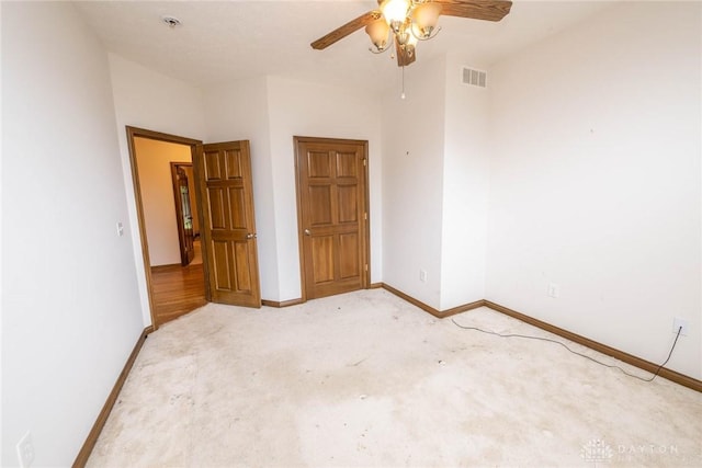 9062 Adam Ln, Waynesville, OH 45068 - unfurnished bedroom featuring light colored carpet, baseboards, and a ceiling fan
