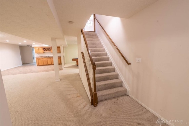 9062 Adam Ln, Waynesville, OH 45068 - staircase with carpet flooring, baseboards, and recessed lighting