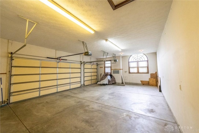 9062 Adam Ln, Waynesville, OH 45068 - garage featuring a garage door opener
