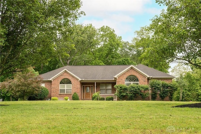 9062 Adam Ln, Waynesville, OH 45068 - ranch-style home with a front yard, brick siding, and covered porch