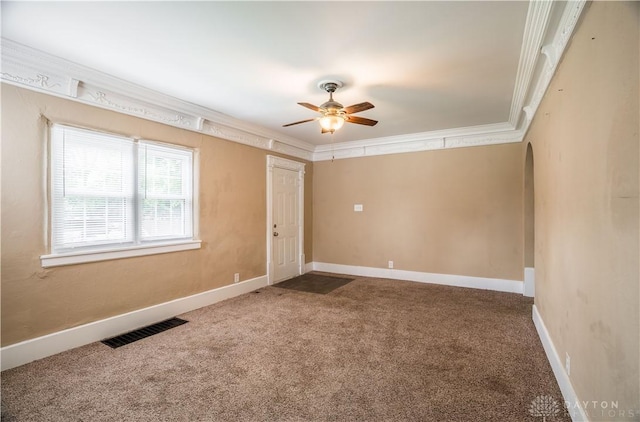 3108 Ohio Ave, Middletown, OH 45042 - carpeted empty room with a ceiling fan, ornamental molding, arched walkways, and baseboards
