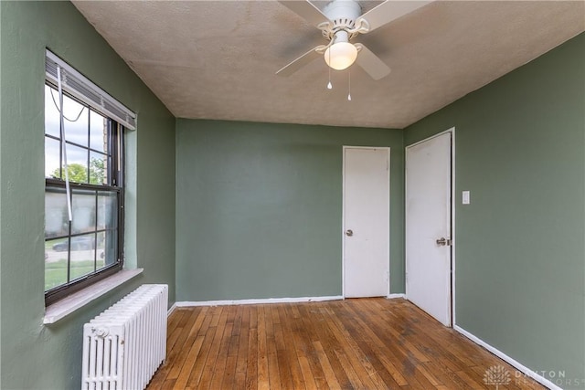515 Aberdeen Ave, Dayton, OH 45419 - empty room featuring radiator, hardwood / wood-style flooring, and ceiling fan