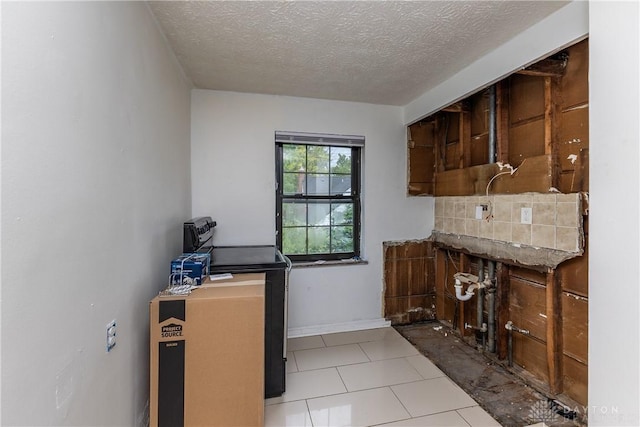 515 Aberdeen Ave, Dayton, OH 45419 - kitchen with backsplash, a textured ceiling, and light tile patterned flooring