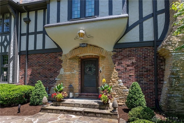 1500 Ridgeway Rd, Oakwood, OH 45419 - view of exterior entry featuring brick siding, stucco siding, and stone siding
