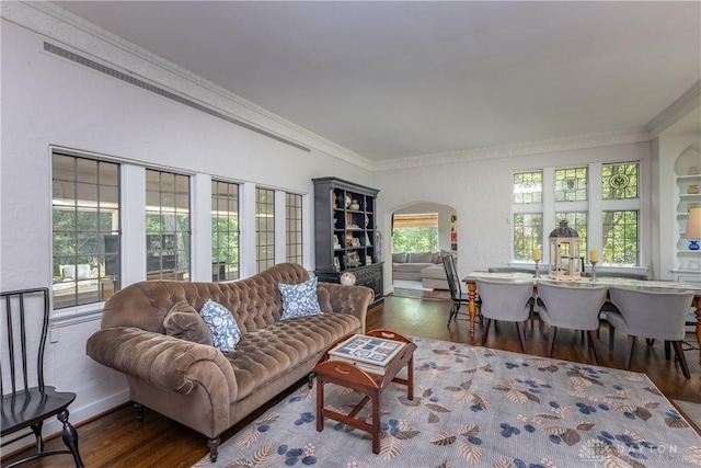 1500 Ridgeway Rd, Oakwood, OH 45419 - living area with arched walkways, wood finished floors, and crown molding