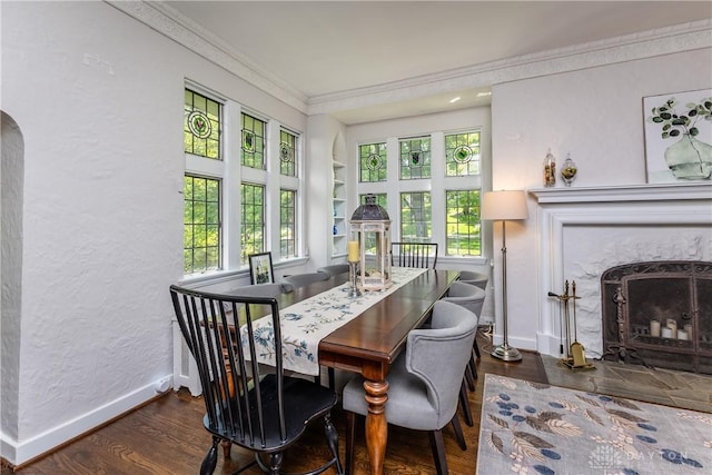 1500 Ridgeway Rd, Oakwood, OH 45419 - dining space with crown molding, a premium fireplace, healthy amount of natural light, wood finished floors, and baseboards