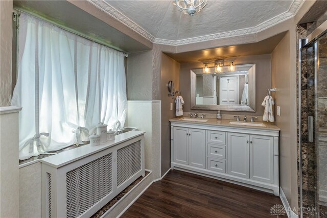 1500 Ridgeway Rd, Oakwood, OH 45419 - full bathroom featuring double vanity, wood finished floors, and baseboards