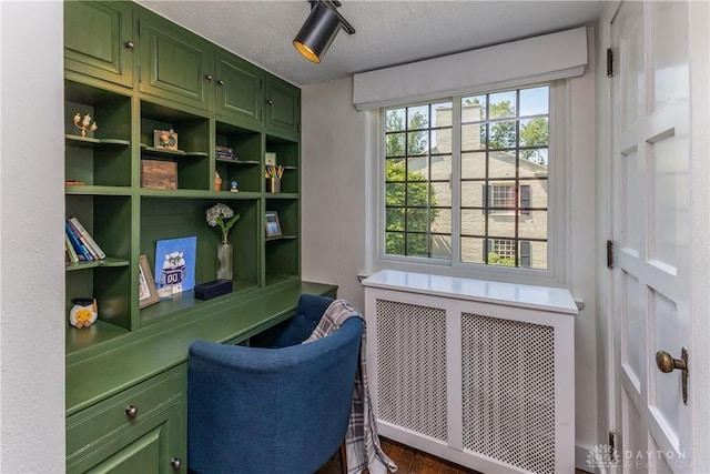 1500 Ridgeway Rd, Oakwood, OH 45419 - sitting room featuring radiator, a textured ceiling, and wood finished floors
