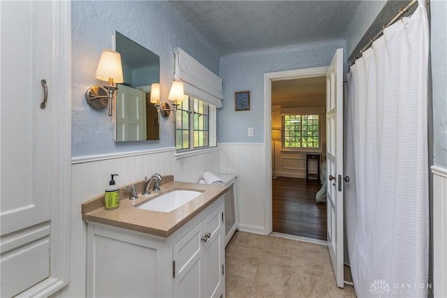 1500 Ridgeway Rd, Oakwood, OH 45419 - bathroom featuring vanity, wainscoting, and a shower with shower curtain