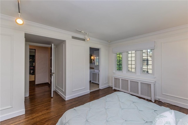 1500 Ridgeway Rd, Oakwood, OH 45419 - bedroom with radiator, wood finished floors, rail lighting, ornamental molding, and ensuite bathroom