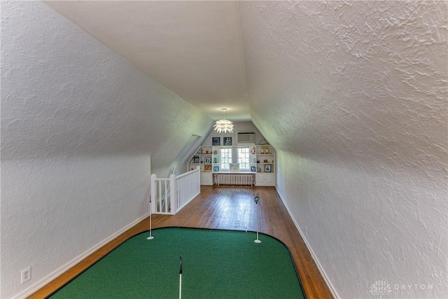 1500 Ridgeway Rd, Oakwood, OH 45419 - bonus room with wood finished floors, vaulted ceiling, baseboards, radiator, and a textured wall