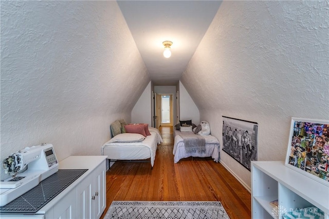 1500 Ridgeway Rd, Oakwood, OH 45419 - bedroom with a textured wall, wood finished floors, and vaulted ceiling