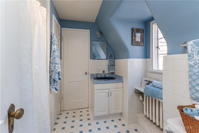 1500 Ridgeway Rd, Oakwood, OH 45419 - full bath with tile walls, vanity, and a wainscoted wall