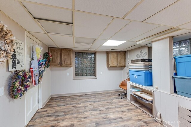 1500 Ridgeway Rd, Oakwood, OH 45419 - unfurnished office featuring wood finished floors, a paneled ceiling, and baseboards