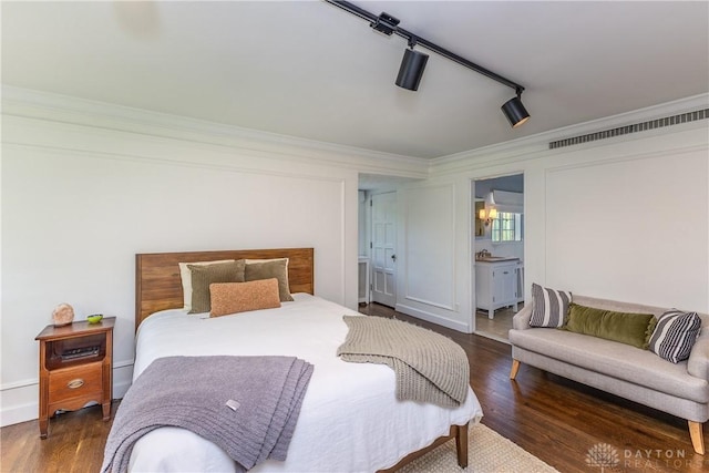 1500 Ridgeway Rd, Oakwood, OH 45419 - bedroom with crown molding, wood finished floors, ensuite bath, and a ceiling fan