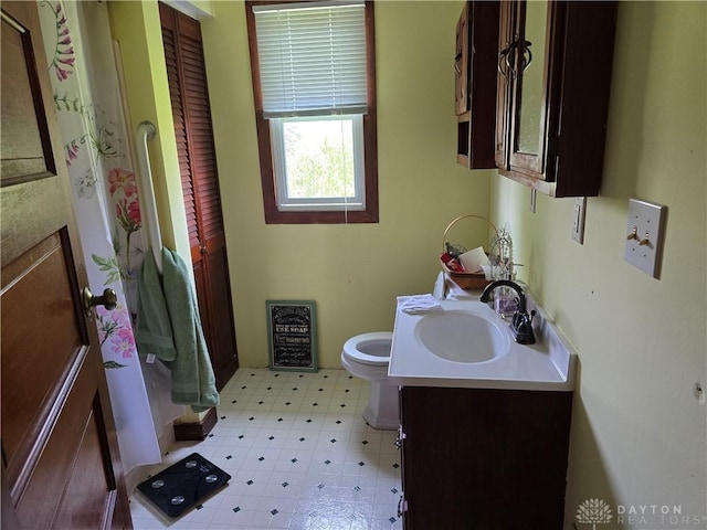 383 Georgetown Verona Rd, West Manchester, OH 45382 - bathroom with vanity, toilet, a shower, and tile patterned floors