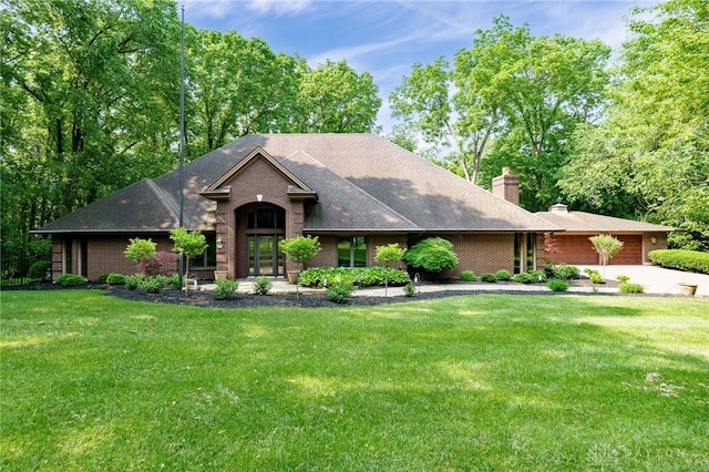 1211 Runnymede Rd, Oakwood, OH 45419 - view of front facade with driveway, brick siding, an attached garage, a front lawn, and a chimney