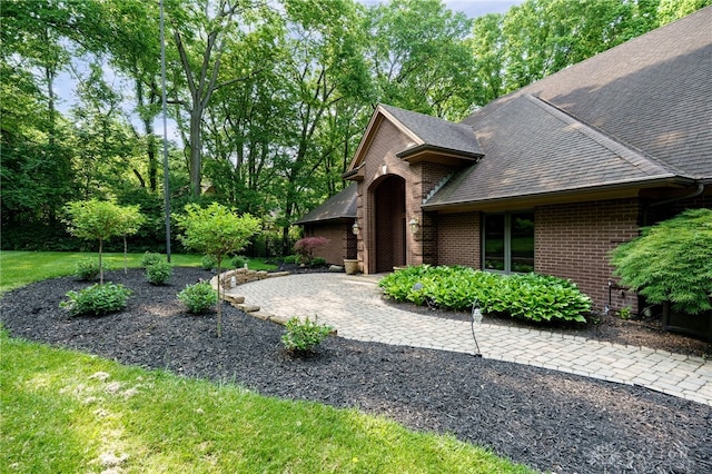 1211 Runnymede Rd, Oakwood, OH 45419 - view of side of property with brick siding and a shingled roof