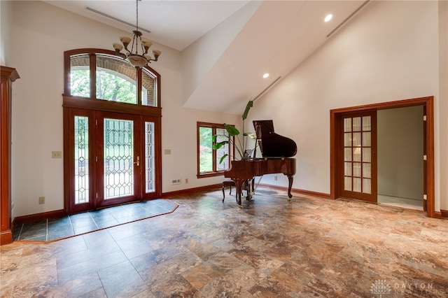 1211 Runnymede Rd, Oakwood, OH 45419 - entrance foyer with high vaulted ceiling, a chandelier, stone finish floors, baseboards, and recessed lighting