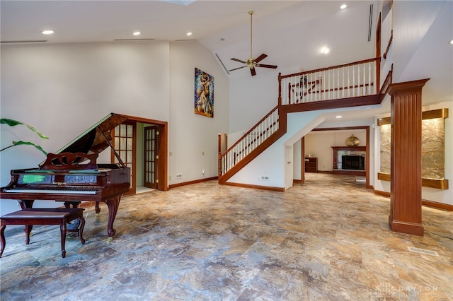 1211 Runnymede Rd, Oakwood, OH 45419 - living room with a ceiling fan, high vaulted ceiling, stairway, stone finish flooring, and baseboards