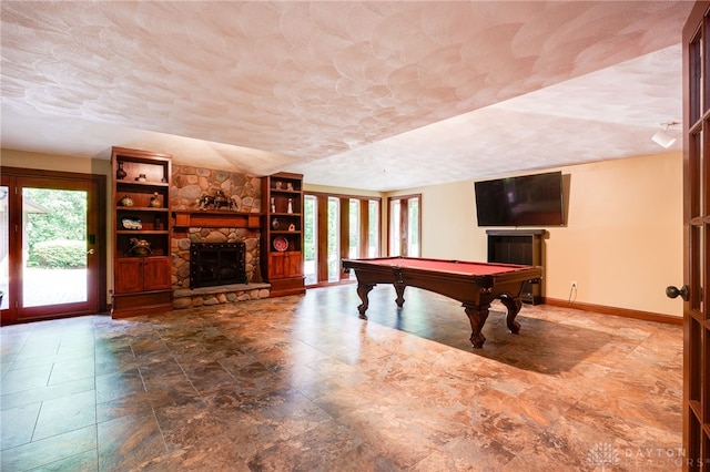 1211 Runnymede Rd, Oakwood, OH 45419 - playroom with a stone fireplace, billiards, baseboards, and stone finish flooring