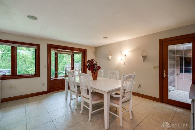 1211 Runnymede Rd, Oakwood, OH 45419 - dining area featuring baseboards and light tile patterned flooring